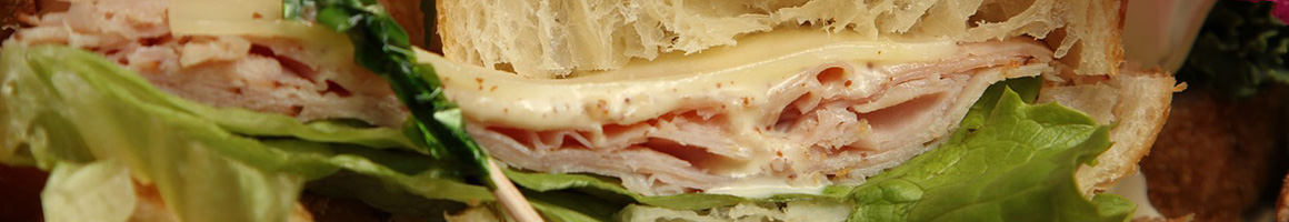 Eating Sandwich Vietnamese Bakery at Alpha Bakery & Deli restaurant in Houston, TX.